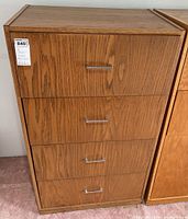 Front view of oak veneer dresser showing four drawers, medium honey oak finish