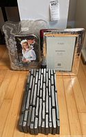 All three items: clear floral frame, Furio silver frame, metal accent panel