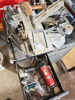 Top view showing Duo-Fast CN-350 nailer, angle grinder, discs and toolbox drawer
