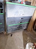 Front view of cabinet showing closed drawers and casters