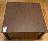 Top view of square walnut veneer coffee table