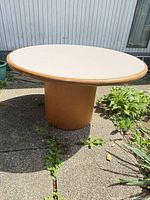 Full view of round dining table outdoors