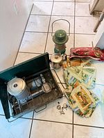 Group shot of stove, lantern, percolator, placemats and clips