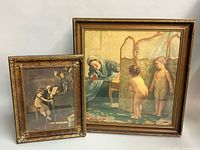 Both framed prints standing side by side