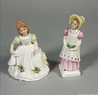 Front view of both Royal Doulton figurines