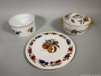 Group shot of soufflé dish, gateau plate, lidded casserole