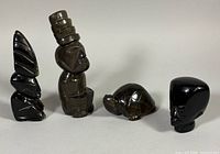 Group shot of all four obsidian figures
