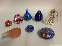 Group of 8 assorted paperweights