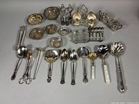 Full set of silver-plate items laid out