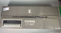 Closed retail box showing Casio CT-607 label