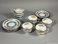 Group view of creamer, side plates, cups and saucers