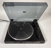 Overall view with lid open showing platter, tonearm and dust cover