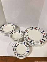 All three stacks showing dinner plates, salad plates and bowls with floral pattern