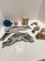 overview of all items including angel plaques, piggy banks, boxed ornament, animal figurines