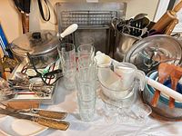 overview of pot, flatware, glasses, cooling rack