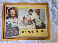 Front view of framed Paula movie poster, landscape orientation