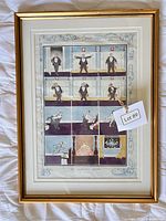 Front view of framed comic print with title visible