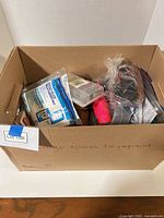 Box overview showing assorted tools and hardware