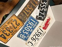 Group of plates and sign laid out for overview