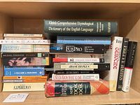 Shelf showing full group of books with dictionary, computing guides, biographies and sociology titles