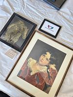 Lot overview showing three framed prints