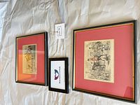 Both framed prints side by side showing size, frames, mats, and art