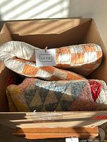 Both quilts folded in box