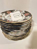 Stacked view of all plates showing edge gilt and count