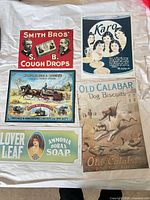 Group shot of five advertising signs laid on white sheet