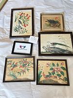 Group shot of five framed prints displaying overall set
