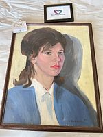 Full view of framed oil portrait painting