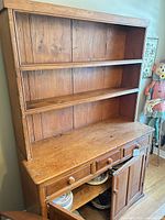 Full view of hutch showing shelving, drawers, cabinet doors