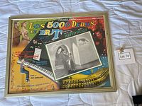 Front view of framed poster showing artwork and Spanish title