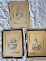 All three framed prints on white surface