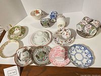 Group shot showing all teacups and saucers in lot