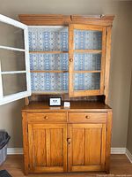 Full view of hutch showing glass display top, drawers, lower cabinet