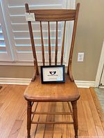 Front view of spindle-back wooden chair