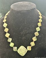 Full view of necklace on display bust