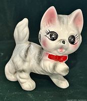 Front view showing eyes, bow, facial details