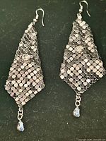 Front view of both metallic mesh earrings showing rhinestones and teardrop drops