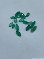Group view of marquise emerald gemstones on white background