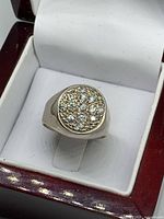 Ring in presentation box, top view showing CZ cluster face