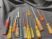 Full group of 16 screwdrivers on black cloth