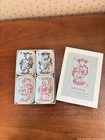 Boxed set of four ashtrays next to lid