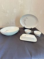 Full set showing platter, bowls, butter dish, teacups