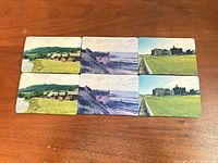 Six landscape photo drink coasters laid out on table, showing all designs