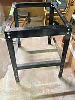 Overall view of black metal stand