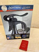 Front of Lightning Lever boxed corkscrew with booklet visible