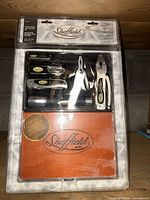 Front view of sealed Sheffield 6-piece tool kit showing all tools and keepsake box