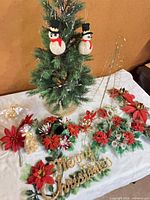 Whole lot with tree, card holder, sign, poinsettias, candle holders